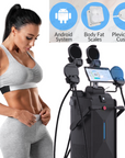 Woman looks at sculpted abdomen, REJUVASCULPT EMSlim Neo Body Contouring Machine, black